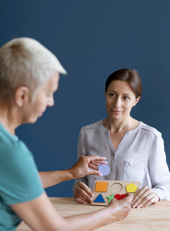 Healthcare professional conducting a cognitive assessment activity with an older adult