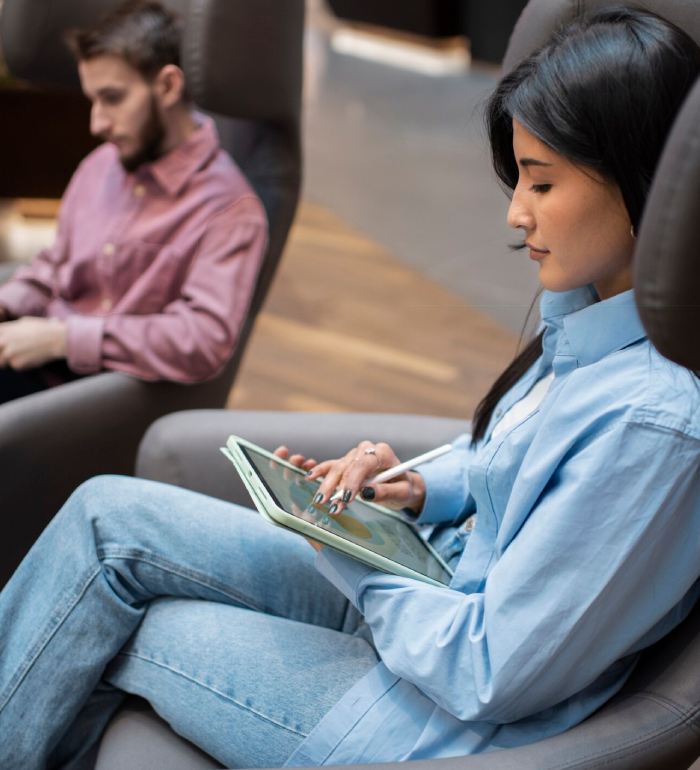 Psychological assessments involving a client completing a mental health questionnaire on a digital tablet in a clinic.