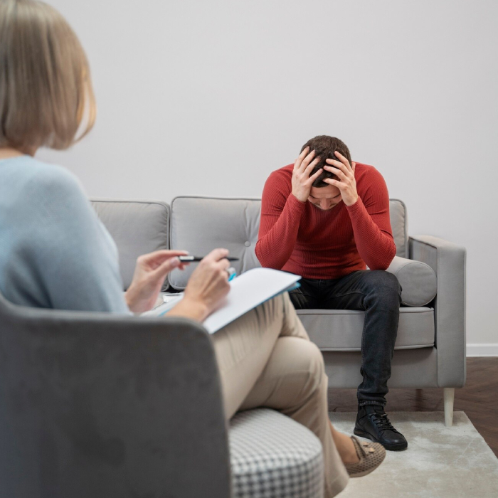 Psychological assessments for anxiety and stress with a therapist evaluating a client during an individual counselling session.